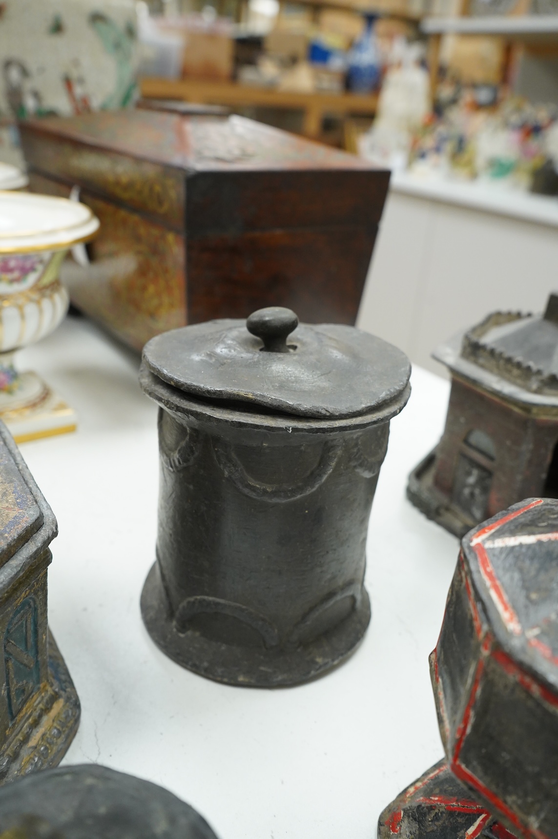 A collection of nine early 19th century lead tobacco boxes and a cover, tallest 20cm